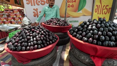 Popular fruit java plum is Reddy to sold in fruit   market in monsoon season Stock Footage 277322930