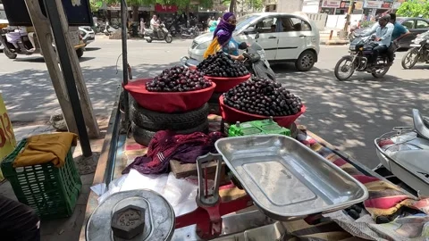 Popular fruit java plum is Reddy to sold in fruit   market in monsoon season Stock Footage 277322940