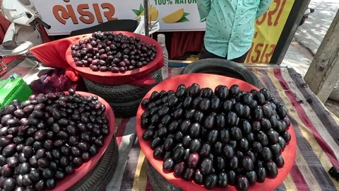 Popular fruit java plum is Reddy to sold in fruit   market in monsoon season Stock Footage 277322985