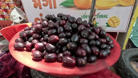 Popular fruit java plum is Reddy to sold in fruit   market in monsoon season Stock Footage 277323021