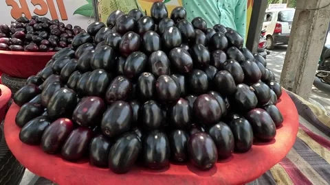Popular fruit java plum is Reddy to sold in fruit   market in monsoon season Stock Footage 277323028
