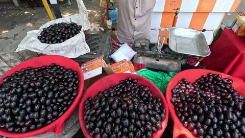 Popular fruit java plum is Reddy to sold in fruit   market in monsoon season Stock Footage 277323046