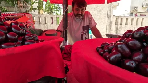 Popular fruit java plum is Reddy to sold in fruit   market in monsoon season Stock Footage 277323112