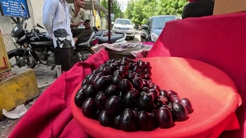 Popular fruit java plum is Reddy to sold in fruit   market in monsoon season Stock Footage 277323300