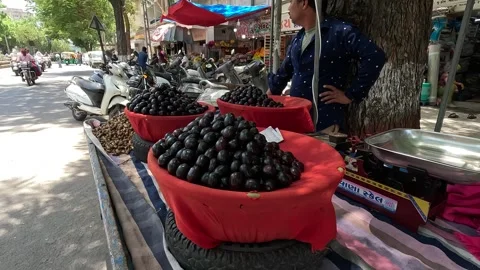 Popular fruit java plum is Reddy to sold in fruit   market in monsoon season Stock Footage 277323318