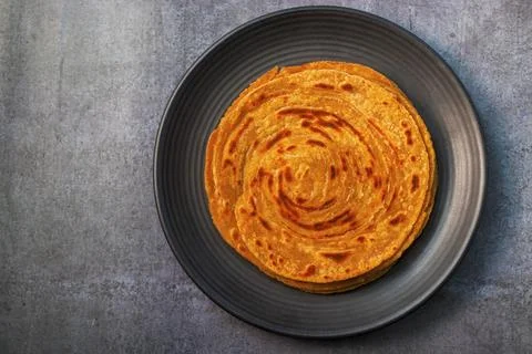 Popular Indian fried flat bread "laccha Paratha". Made of wheat flour. Stock Photos