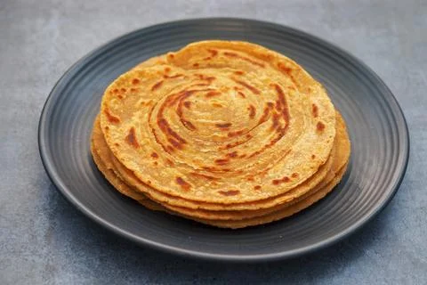 Popular Indian fried flat bread "laccha Paratha". Made of wheat flour. Stock Photos