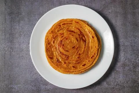 Popular Indian fried flat bread "laccha Paratha". Made of wheat flour. Stock Photos