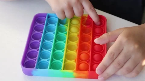 Popular multi-colored silicone game Simple Dimple close-up. Stock Footage 154906085