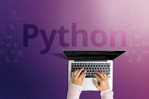 The popular Python programming language with a person behind a laptop Stock Photos