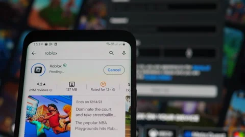 The popular roblox game is installed on a smartphone. The roblox game appli.. Stock Footage 257587758
