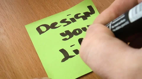 Popular slogan written in a notebook Stock Footage 68188480