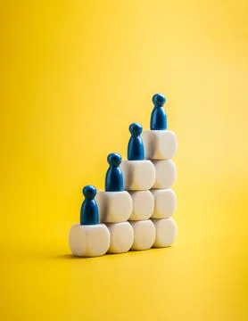 Population growth and technology development concept with blue wooden figur.. Stock Photos