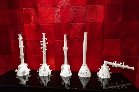 Porcelain elements in the interior and decor on the background of red velvet Stock Photos