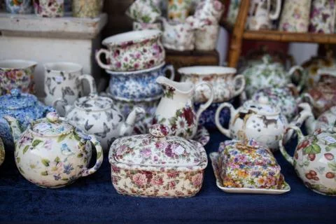 Porcelain objects with a floral theme in a stand Stock Photos