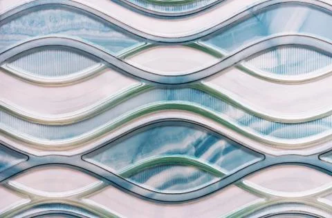 Porcelain stoneware tile with a wavy pattern. Background of porcelain stoneware. Stock Photos