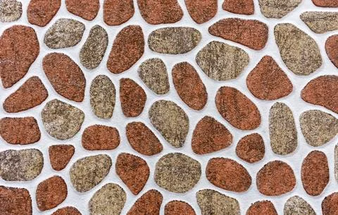 Porcelain tile with a pattern of stones of different shapes and sizes. Stock Photos