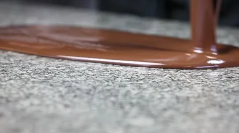 Poring chocolate on working surface Video stock 11403987