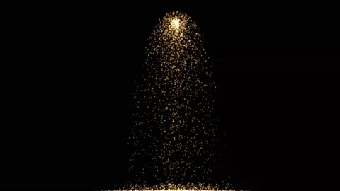 Poring gold particles motion graphics with night background Stock Footage 166025407