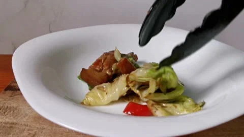 Pork and Cabbage Stir Fried Served in a Plate Stock Footage 235499352