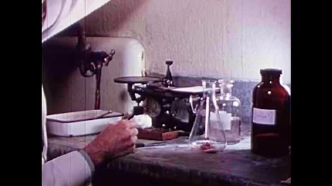 Pork is artificially digested to test for the parasite Trichinosis in the 1940s Stock Footage 101310918