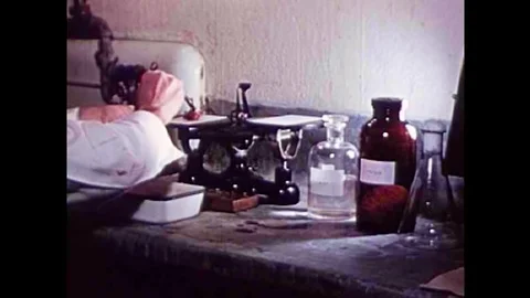Pork is artificially digested to test for the parasite Trichinosis in the 1940s Stock Footage 101311024
