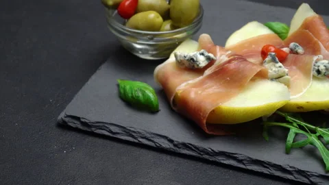 Pork bacon slice with potatoes on back wooden cutting board. Slow motion Stock Footage 133605537