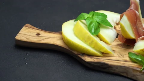 Pork bacon slice with potatoes on back wooden cutting board. Slow motion Stock Footage 133605718