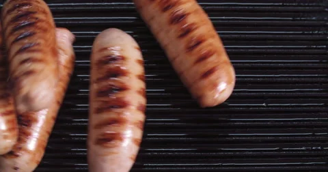 Pork bangers in pan Stock Footage 60782818
