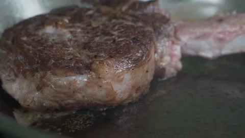 Pork on a bone. Beef steak on the bone, cooked on the grill. Stock Footage 155906151