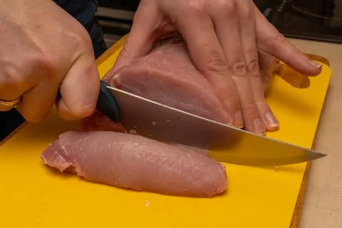Pork chop cutting process on a yellow notch Stock Photos