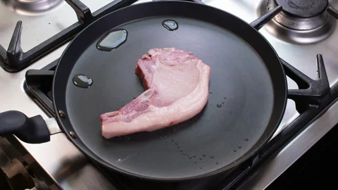 Pork Chop Frying on Pan Stock Footage 248747775