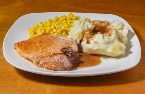 Pork chop served with mashed potatoes and gravy, Stock Photos