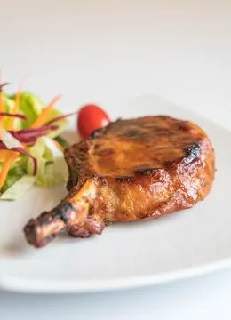 Pork chop steak on the table Stock Photos