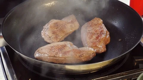 Of pork chops are fried in a frying pan with dill and spices. Stock Footage 107532447