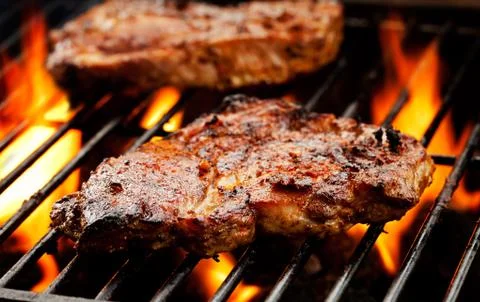 Pork Chops On The Barbecue Stock Photos