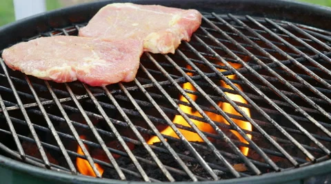 Pork Chops Being Placed On Barbecue Stock Footage 51827835