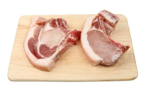 Pork chops on a board Stock Photos