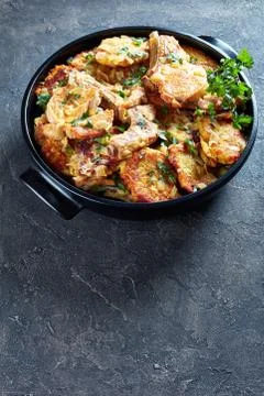 Pork chops on bone and hash brown Casserole Stock-Fotos