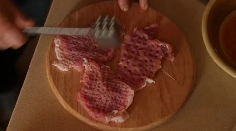 Pork chops with egg and breading preparation for frying time lapse Stock Footage 48249374