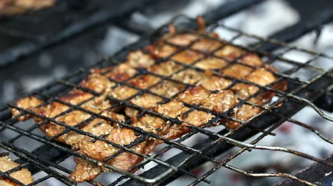 Pork chops getting grilled on grill with flames. Stock Footage 53835775