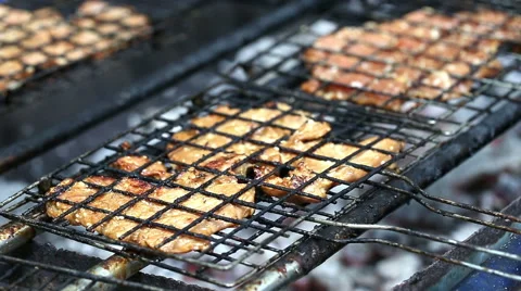 Pork chops getting grilled on grill with flames. 스톡 동영상 53836175