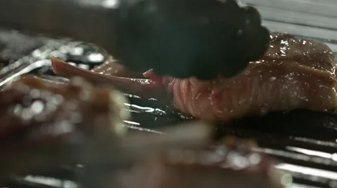 Pork Chops on a griddle pan. Slow Motion. Stock Footage 41204674