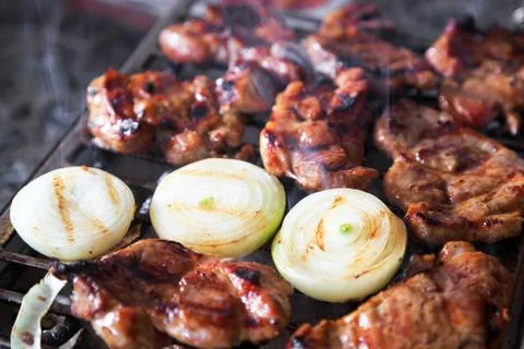 Pork chops on grill Stock Photos