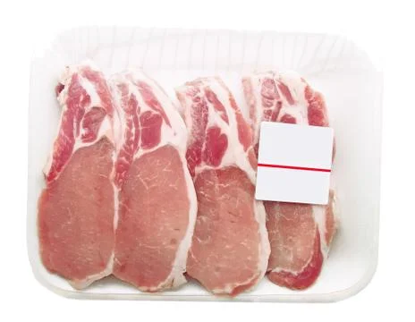 Pork chops packaged in a container with a price tag Stock Photos