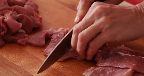 Pork cut onto chunks, close-up Stock Footage 107935300