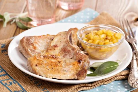 Pork cutlets on a bone with apple chutney Stock-Fotos