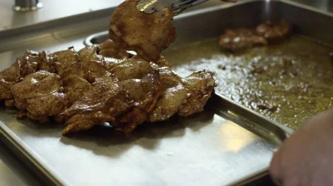 Pork fried on a restaurant kitchen Stock Footage 63840139
