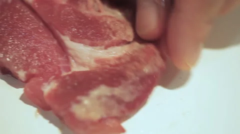 Pork on a frying pan Stock-Footage 55658115