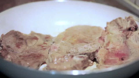 Pork on a frying pan Video stock 55660471